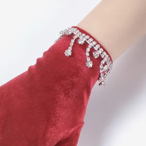 Red velvet gloves with rhinestone tassel wrist design, elegant women winter warm apparel.
