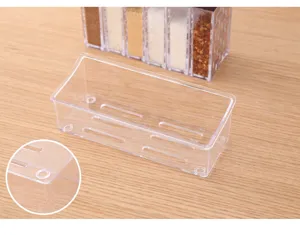 Transparent kitchen storage box detail view, plastic spice rack organizer holder compartment.
