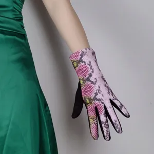 Detailed view of women's pink snake print touchscreen warm gloves for autumn and winter driving.