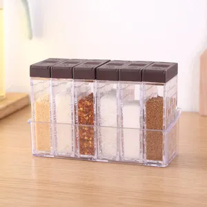 Clear 6-piece spice jar set with tray for kitchen seasoning storage, modern transparent design.