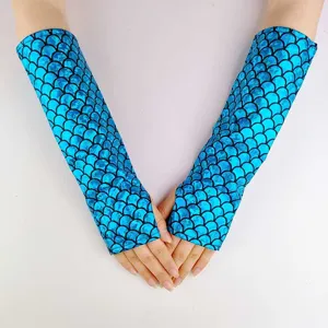 Close-up detail of blue iridescent mermaid scale fingerless gloves for cosplay costume.