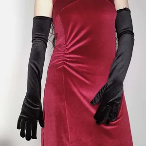 Detail view of black velvet long evening gloves, retro opera party costume accessory.