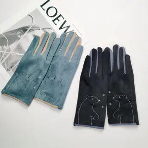 Detail of suede touch screen winter gloves featuring cute embroidered bears and warm plush lining.