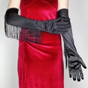 Detail view of long black satin fringe gloves, elegant evening party accessory for dance.