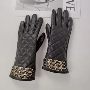 Women winter black PU leather quilted gloves with gold chain cuff, warm and windproof detail.
