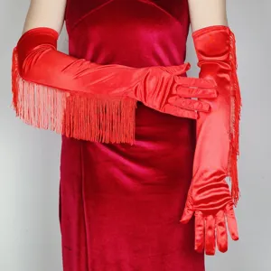Close-up detail view of red satin long gloves showcasing elegant fringe for performance.