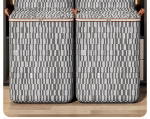 Large capacity striped quilt storage bag with handles and zipper, durable clothing organizer.