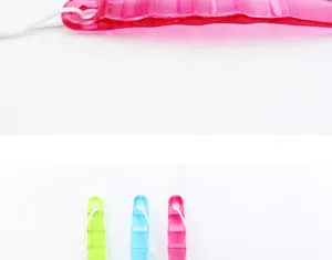 Long handled bath scrubber detail view, colorful plastic hanging design, body brush.