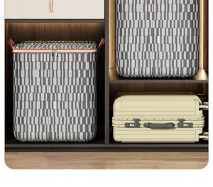 Detailed view of striped large capacity quilt and clothing storage bag with handles.
