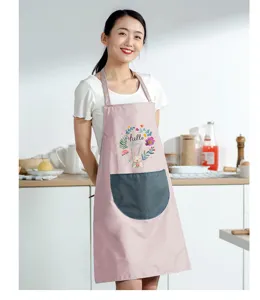 Kitchen apron detail shot featuring cute rabbit floral print and practical pocket design.