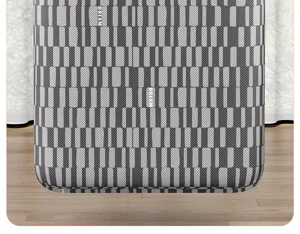 Detailed view of the large capacity quilt storage bag with gray striped pattern and texture.