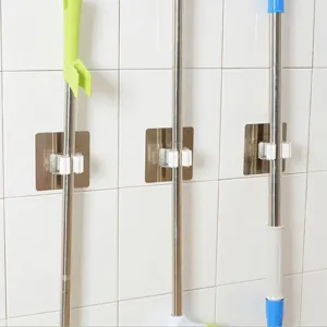 Self-adhesive mop holder wall mounted broom gripper organizer for home kitchen bathroom.