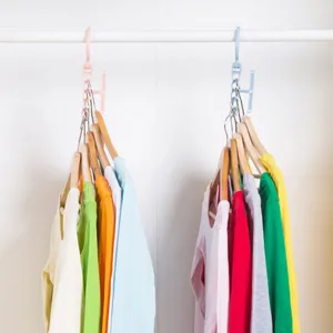 Multi-hole magic clothes hanger with handle, rotating space-saving organizer for wardrobe.