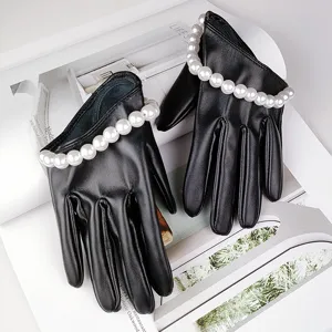 Black faux leather short gloves with white pearl trim, stylish design for women's fashion wear.