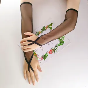 Close-up detail of black mesh long gloves with finger loop, sexy costume accessory for party.