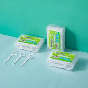 Disposable dental floss picks in clear portable plastic storage boxes, 50 pieces per box set.