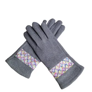 Women's winter warm fleece-lined grey faux suede gloves with colorful embroidered grid cuff.