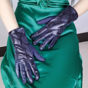 Detailed shot of women's autumn winter snakeskin faux suede gloves in deep blue, stylish warm fit.