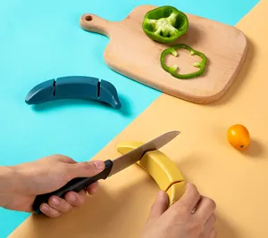 Banana shaped kitchen knife sharpener, two stage manual quick sharpening tool for home use.