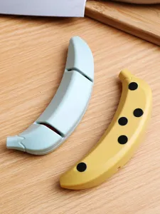 Banana shaped two stage kitchen knife sharpener detail view, non slip design for home use