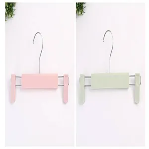 Plastic pants hanger with adjustable clips, durable clothes organizer for underwear and skirts.
