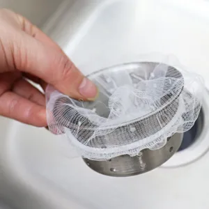 Kitchen sink strainer basket with white mesh filter bags for effective kitchen debris anti-clogging.