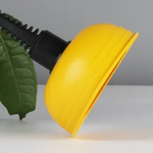 Mini pipe dredging plunger detail view, yellow rubber suction cup and black handle for sink.