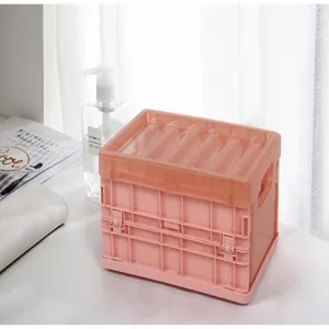Detail view of the pink foldable plastic storage box showing lid and side buckle design.