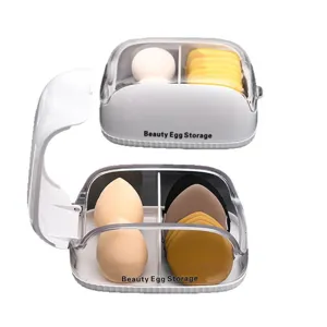 Boîte de rangement pour éponge de maquillage avec couvercle transparent anti-poussière.