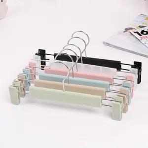 Multifunctional plastic pants hangers with adjustable metal clips, clothes storage rack
