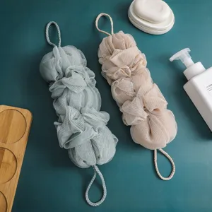 Longue eponge de bain en filet pour le corps, gommage exfoliant avec boucle de suspension.