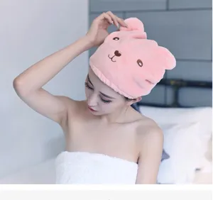 Close-up detail of the soft pink bear dry hair towel wrap, showing absorbent fabric and cute ears.