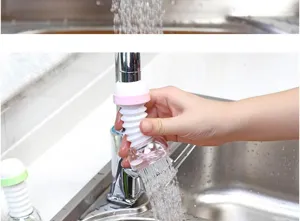 Kitchen faucet splash-proof filter detail showing the flexible white nozzle in use.