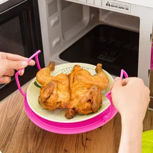 Multifunctional microwave dish tray with handles, pink heat-resistant kitchen tool main view.