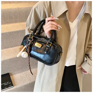 Vintage black bowling handbag with cute sports charms, stylish shoulder bag for women