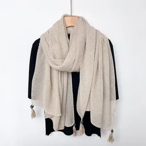 Beige solid color crinkled scarf with tassel pendants, lightweight and elegant fall winter accessory.