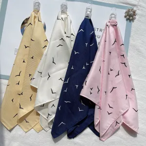 Spring summer fashion simulated silk small square scarf with abstract bird print for women detail.