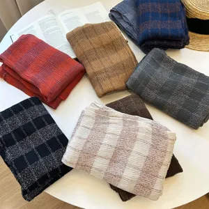 Stylish plaid scarf for women, cozy multi-color cotton linen shawl, autumn winter fashion accessory.