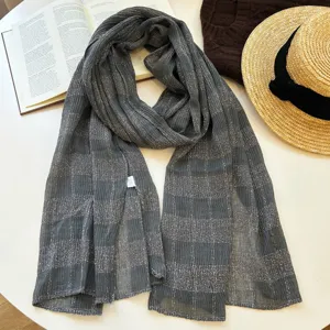 Detailed view of women autumn grey plaid scarf shawl, soft texture, elegant daily wear.