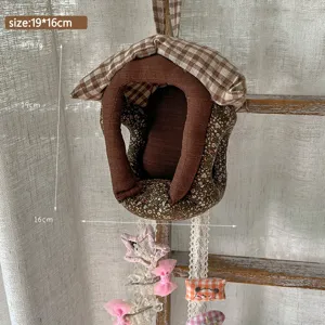 Fabric house hanging organizer for hair clips and dolls, handmade quilted storage bag decor.