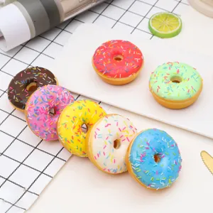 Close-up view of colorful assorted simulated donuts with sugar sprinkles for food play