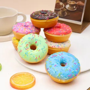 Macro view of assorted colorful PU simulated donuts with rainbow sprinkles for props