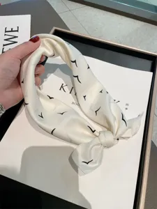 Chic 53cm silk scarf featuring elegant black bird prints, perfect spring summer sun protection accessory.