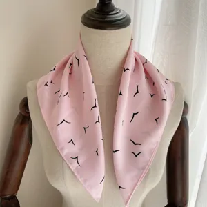 Chic pink satin silk square scarf with trendy black bird print for women fashion daily wear.