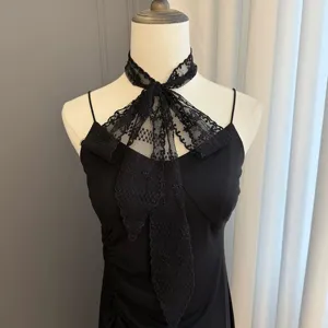 Exquisite black lace ribbon scarf detail shot, elegant necktie and versatile accessory.