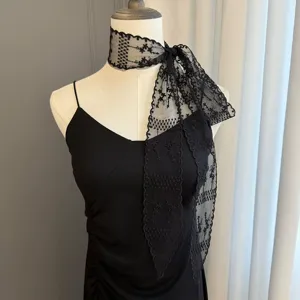 Black lace hair scarf detail, elegant floral mesh ribbon for versatile styling.