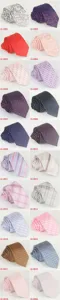 Close-up detail of stylish men's slim polyester business neckties featuring various patterns.