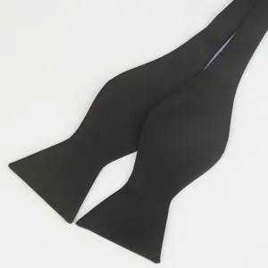 Black polyester self-tie bow tie for men, classic gourd shape formal wear accessory.
