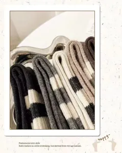 Detailed shot of retro striped mid-tube cotton socks in neutral earth tones closeup.