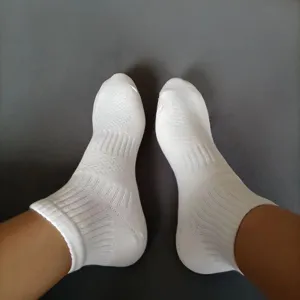 Men's white cotton sports short socks with breathable honeycomb mesh and cushion design.